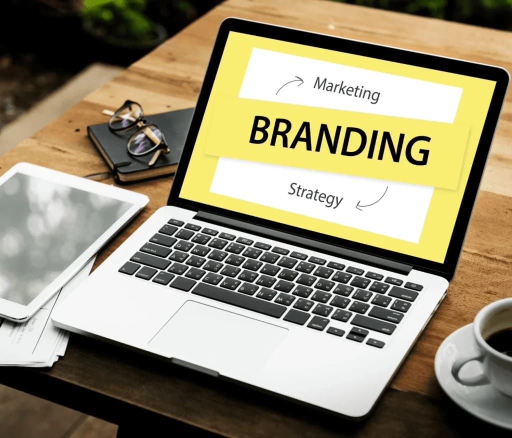 Branding workspace with laptop showing branding strategy